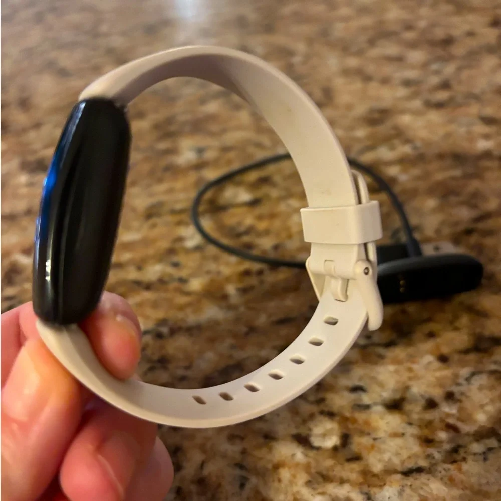 Excellent used condition. Includes charger and extra strap.